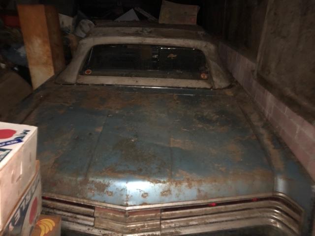 old buick in a barn